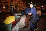 Hong Kong cop removes barricades