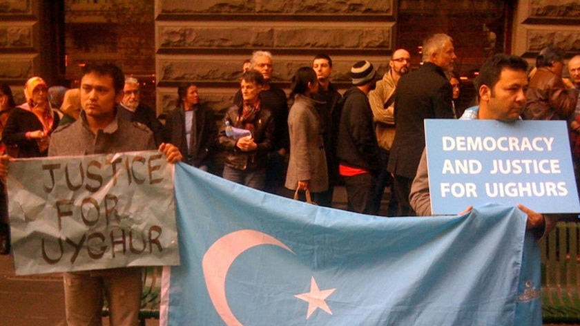 Demonstrators wait for the arrival of Rebiya Kadeer outside the screening of a film about the exiled Uighur leader in Melbourne.
