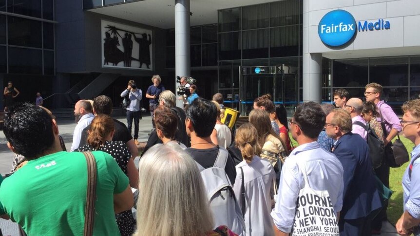 Fairfax staff stand outside their Sydney workplace.