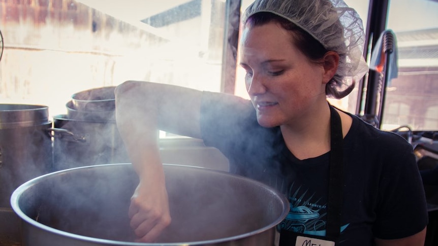 Melissa Paisley stirs a large pot at the Two Good restaurant in Sydney