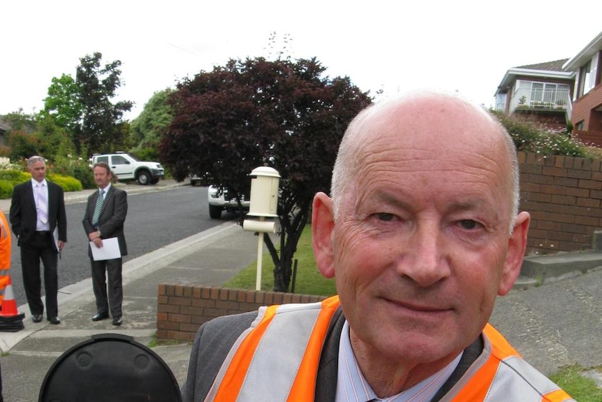 Chairman of the Tasmanian Water and Sewerage Corporation, Geoff Willis with a water meter