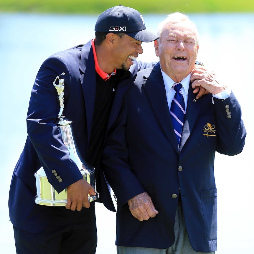 Woods shares a laugh with Palmer