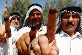 Iraqis voters showing ink-stained fingers