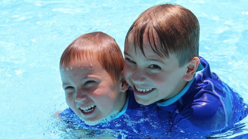 Tobias and Mathias Tennant enjoy the water