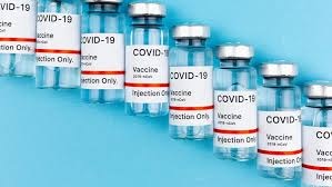 A row of Covid-19 vaccines bottles