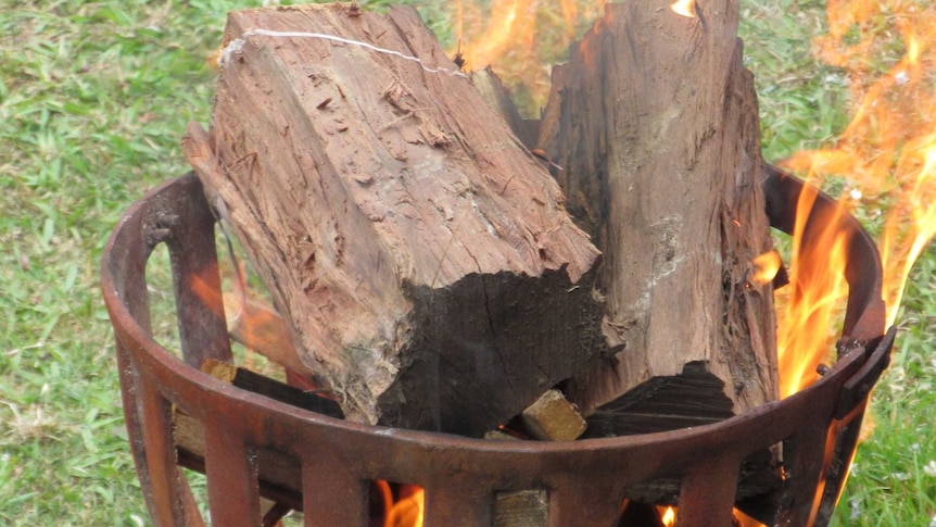 Flames and wood in an outdoor brazier