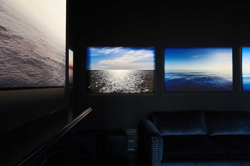 Images of the ocean and blue sky in a room at the exhibition