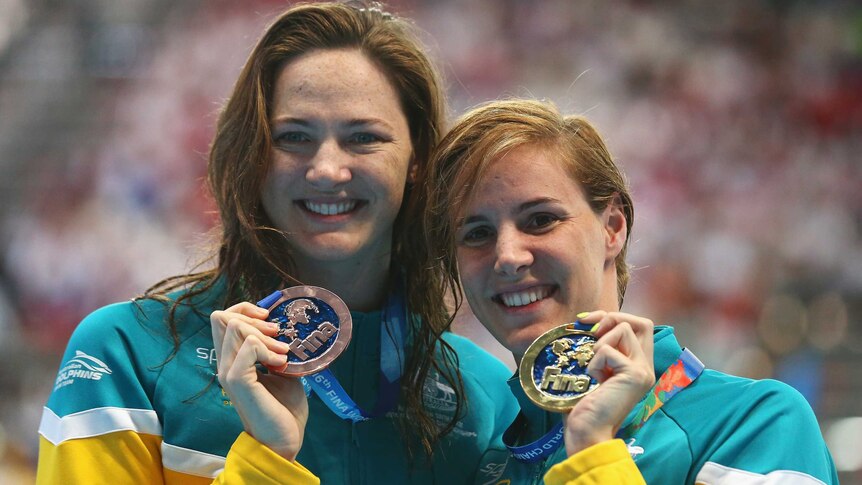 Australia's Bronte Campbell (R) poses with sister Cate after 100m freestyle final in Kazan.