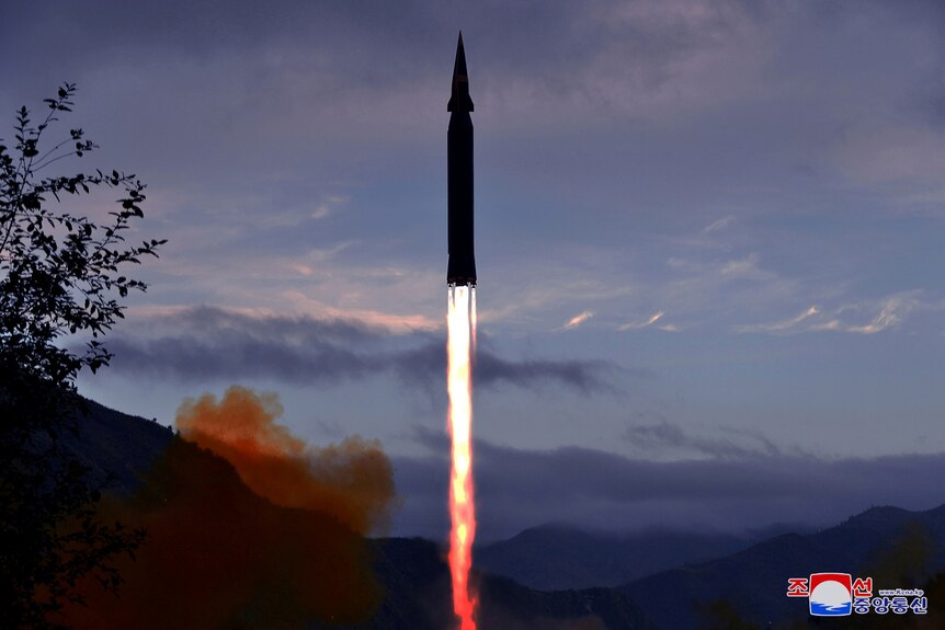 A hypersonic missile blasts off from land.
