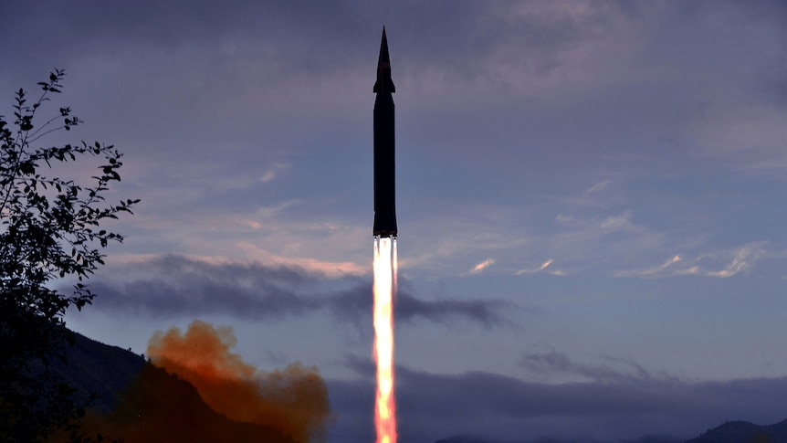 A hypersonic missile blasts off from land.