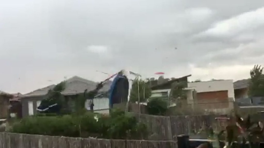 A trampoline is blown through the Canberra suburb of Harrison during the storm. (Supplied: Travers Jay)