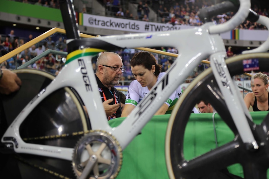 Gary West and Anna Meares chat behind a bike at the World Cycling Championships.