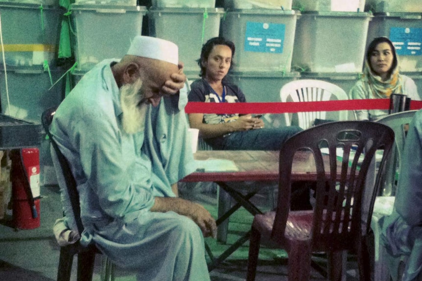 An Afghan man at the recount centre