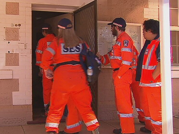 The accused was filmed at the rear of the SES team which helped investigate