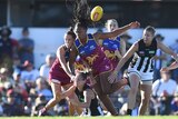 Brisbane's Sabrina Frederick-Traub (C) in action during the Lions' AFLW match against Collingwood.