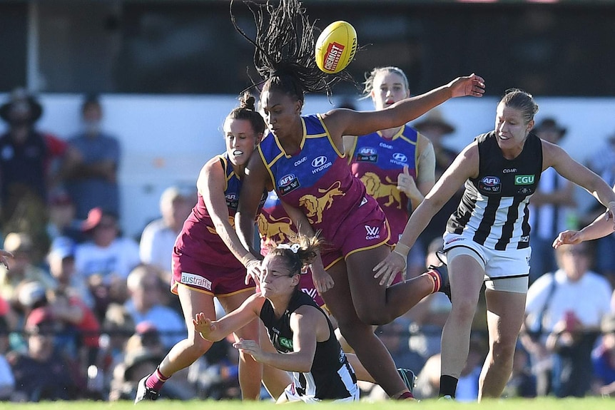 Sabrina Frederick-Traub attacks the ball for the Lions in their AFLW match against Collingwood