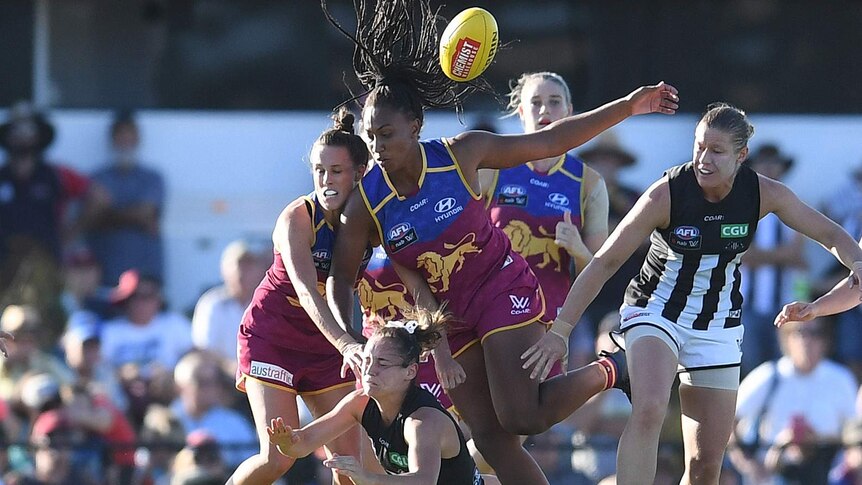 Sabrina Frederick-Traub attacks the ball for the Lions in their AFLW match against Collingwood