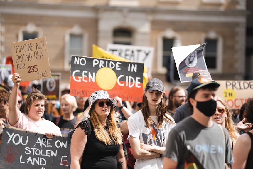 Protesters carrying signs