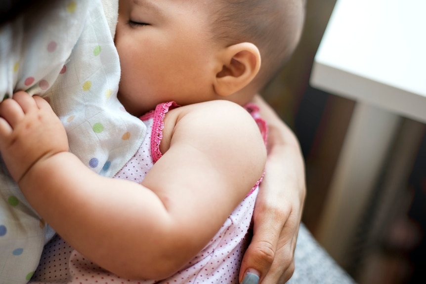 Mother breastfeeding her baby