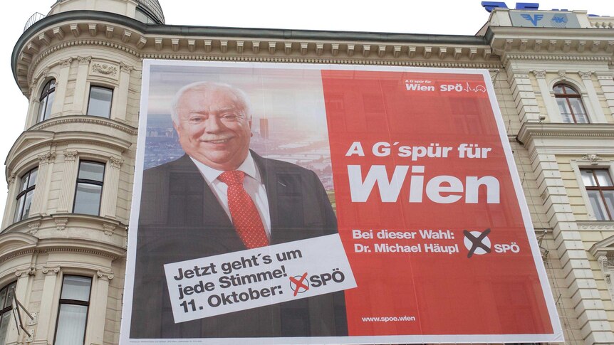 A campaign poster showing Dr Michael Häupl sits on the wall of the headquarters of Austria's Social Democrats.