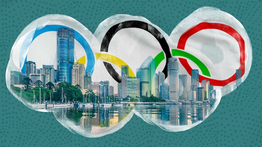 The Olympic rings with the Brisbane skyline superimposed over them.