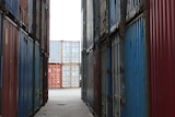 Shipping containers stacked on top of each other.