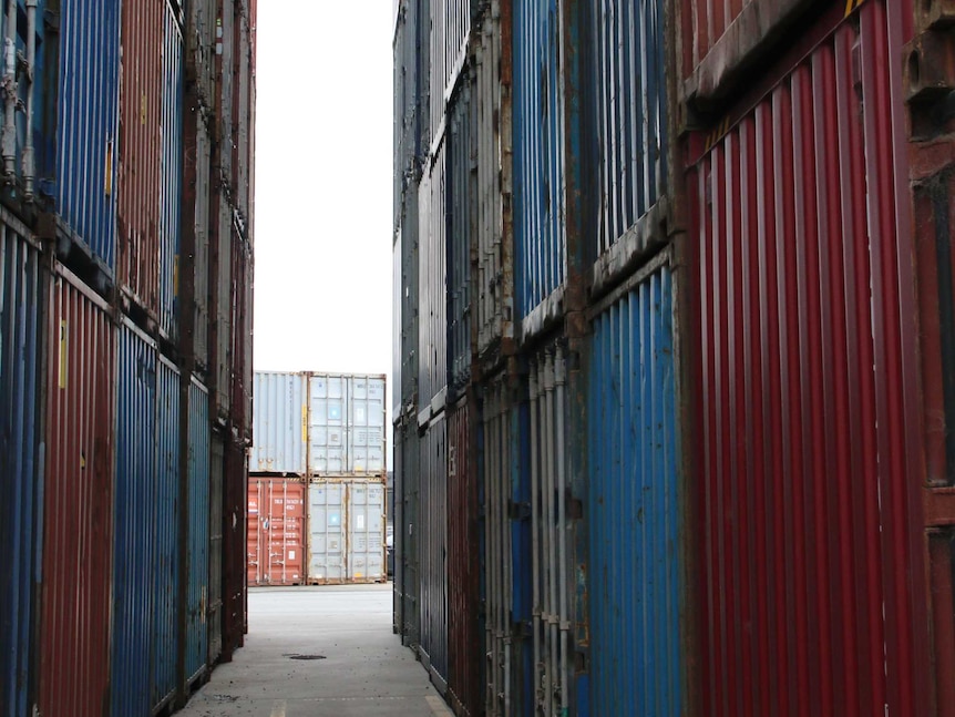 Shipping containers stacked on top of each other.