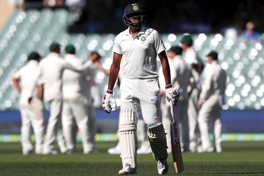 Ravi Ashwin leaves the field after being dismissed against Australia.