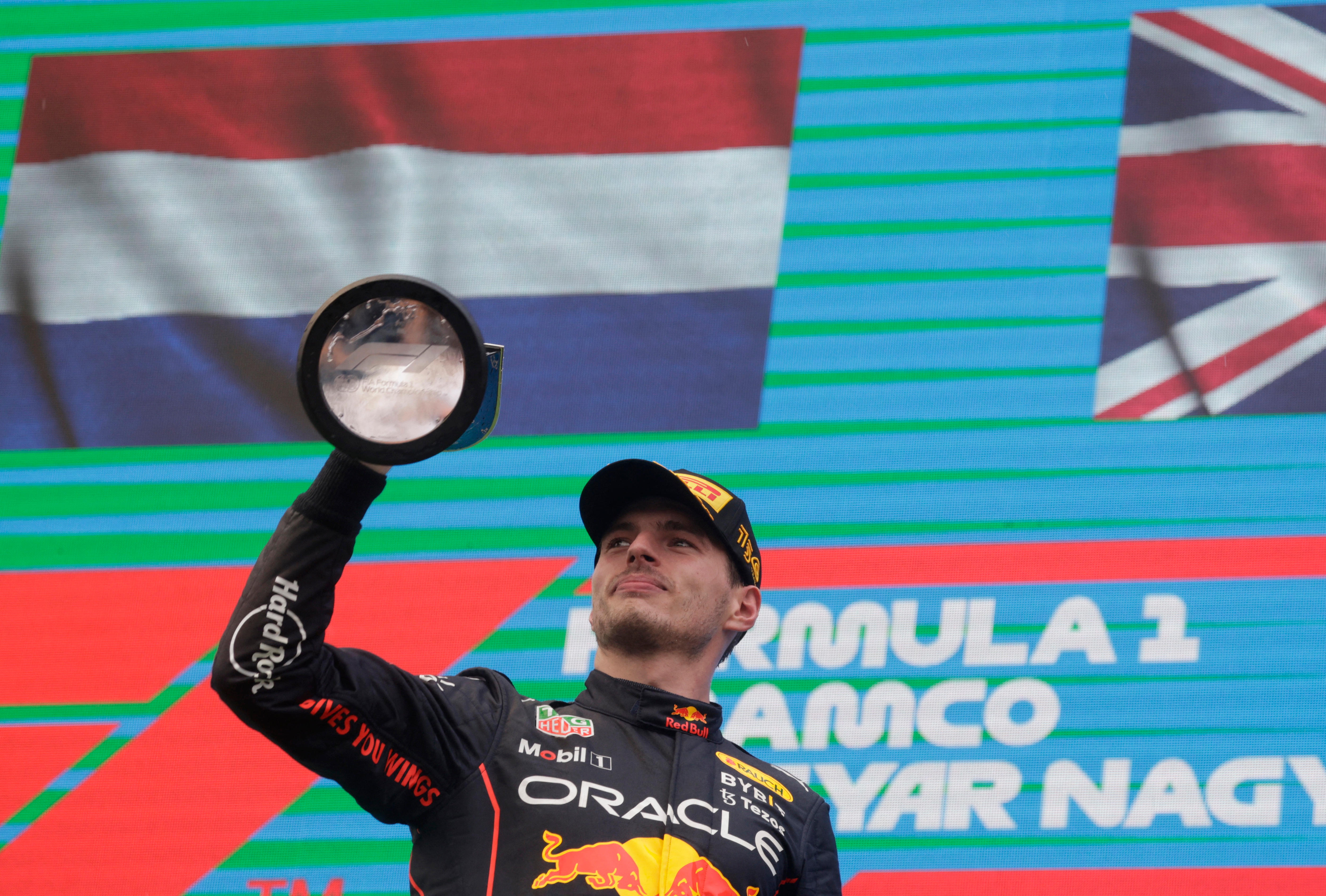 Max Verstappen wins the Hungarian Grand Prix, holds the trophy. 