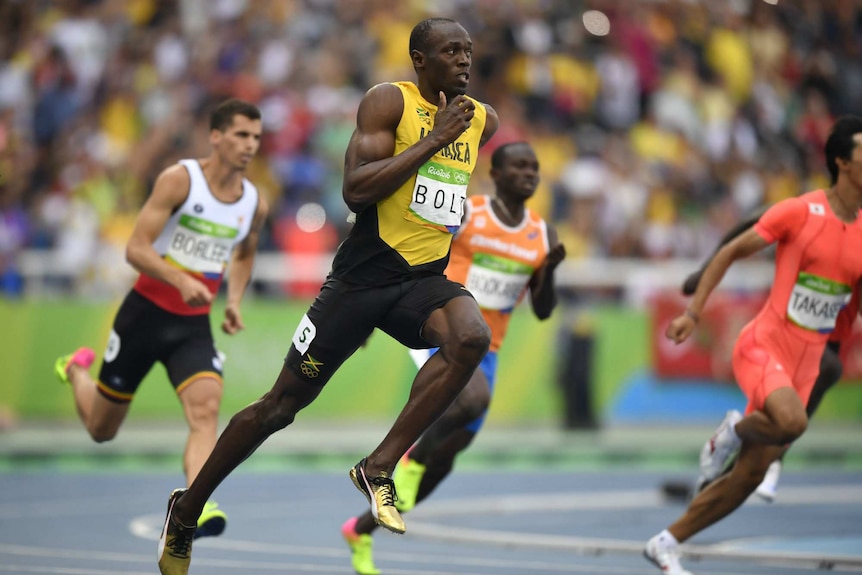 Usain Bolt competes in 200m heats