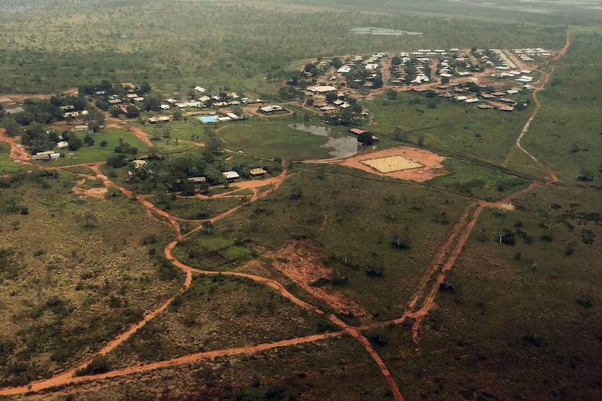 An aerial view of a remote settlement in the outback.