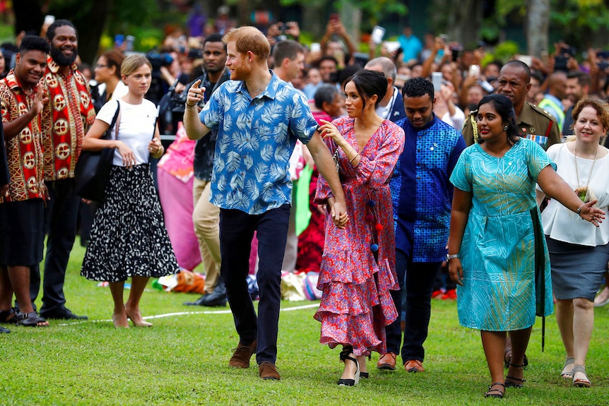 Crowds swarm around the royals during their tour of Fiji.