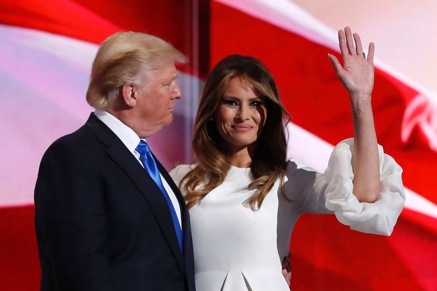 Melania Trump stands with Donald Trump