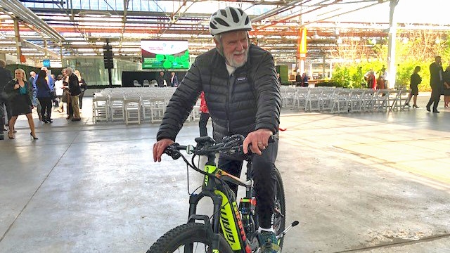 George Adams on an e-bike