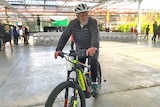 George Adams on an e-bike