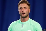 Liam Broady looks frustrated and holds his arms out.