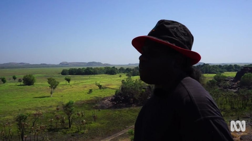 Aboriginal man views Kakadu plains