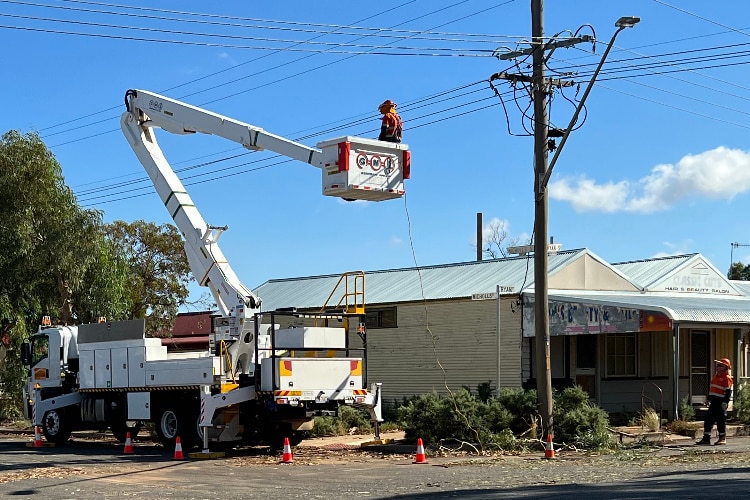 Essnetial energy worker working on fixing powerlines following a storm in Broken Hill. 