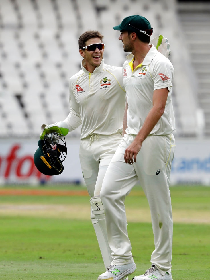 Australia's captain Tim Paine celebrates with teammate Pat Cummins