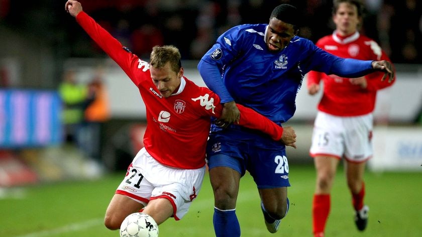 Eyes on the prize ... Kristjan Sigurdsson of Brann holds off Victor Anichebe of Everton