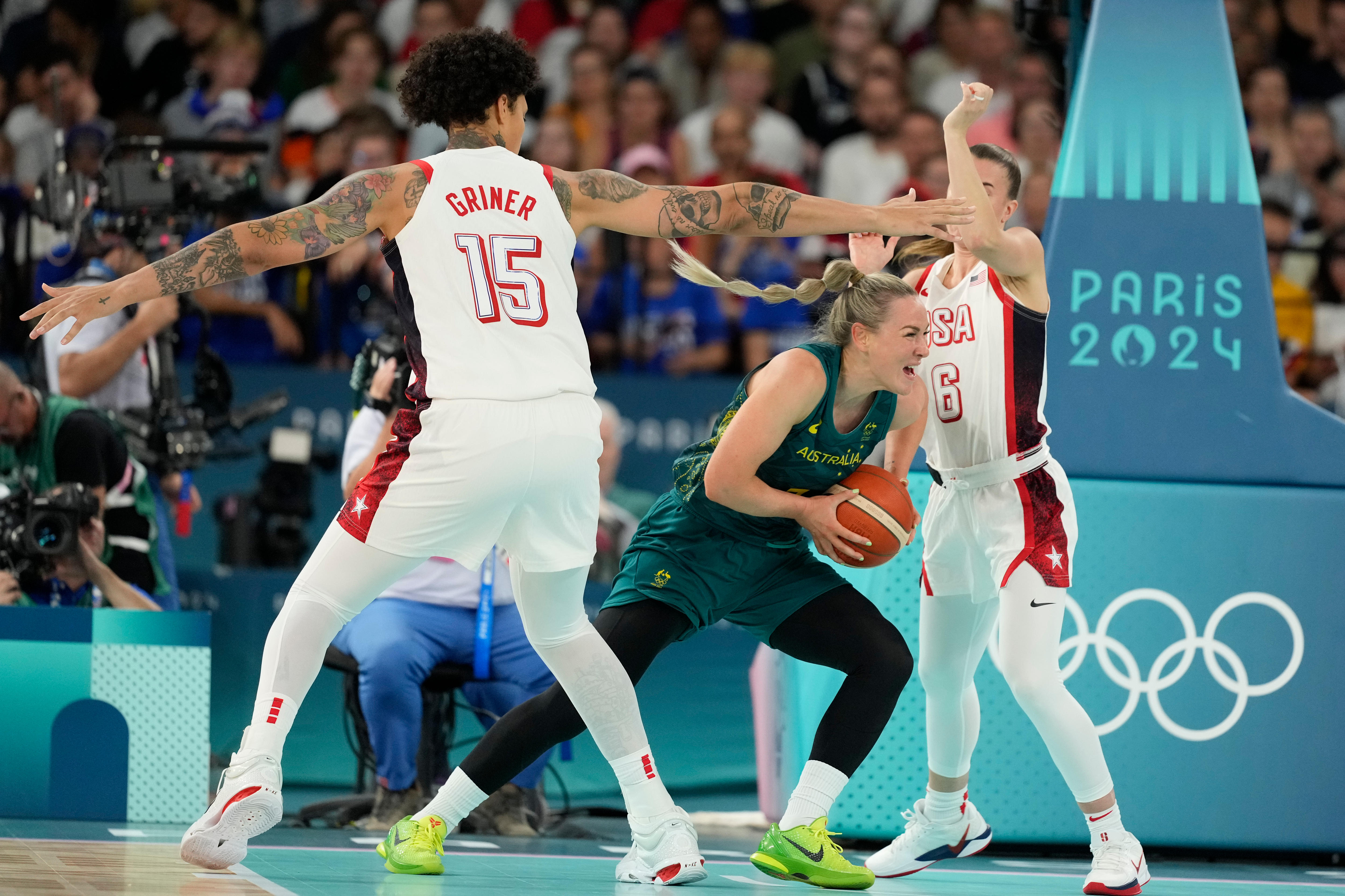 Tess Magden tries to get around two US opponents