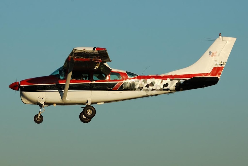 A Cessna 210 flies in October, 2007.