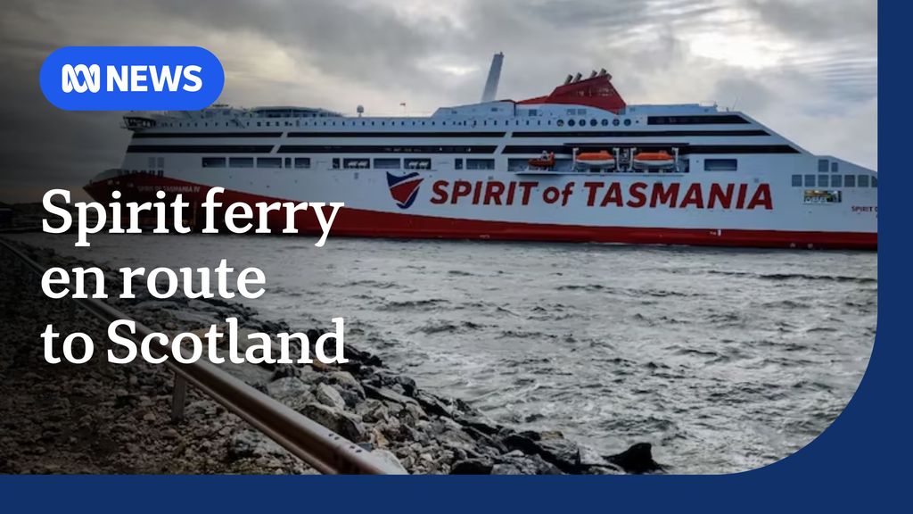 Spirit ferry en route to Scotland: Large passenger ferry painted red and white with 'Spirit of Tasmania' on the side.