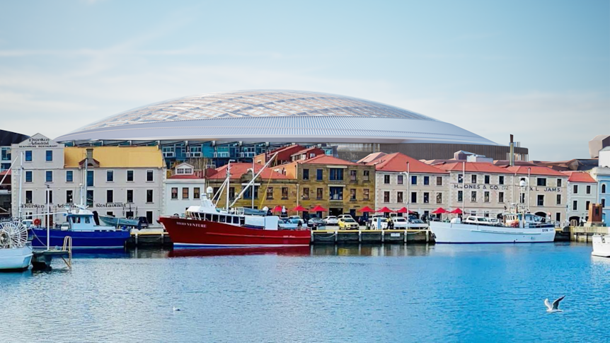 Artist impression of a proposed stadium, seen behind a line of smaller buildings.