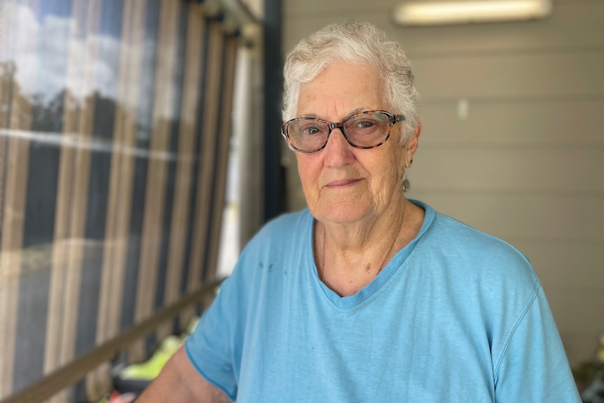 82-year old resident of Brigadoon Caravan Park Dene Harper standing on her front porch