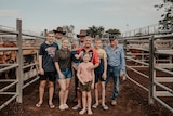 The Matthews family with Brent Williams, saleyard contractor Ron Philipson and and Dick Pugh
