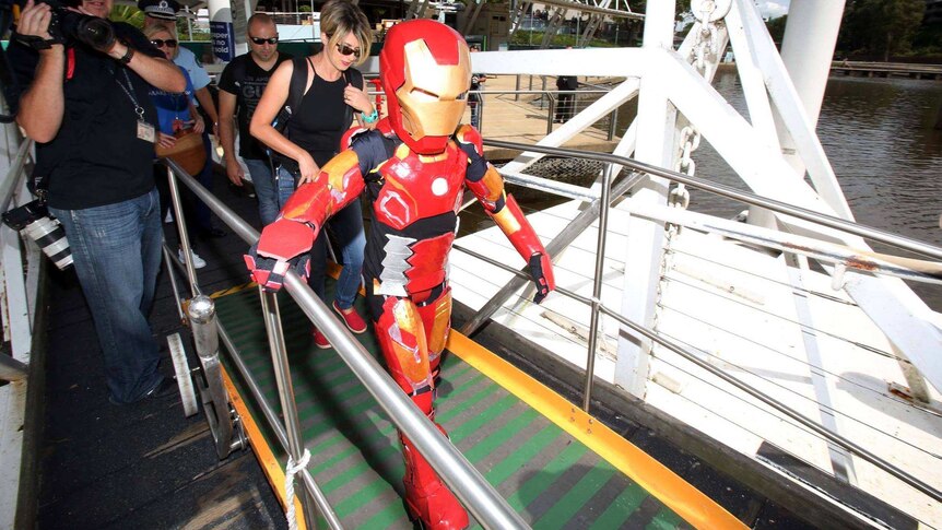 Iron boy getting onto a ferry