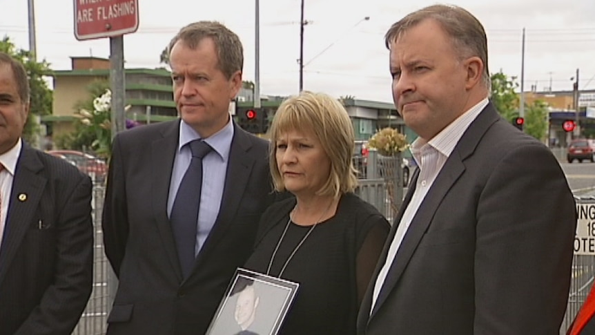 Federal MPs Bill Shorten and Anthony Albanese at the St Albans level crossing with campaigner Dianne Dejanovic.