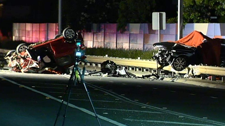 Two cars at the scene of a fatal crash involving excessive speed.