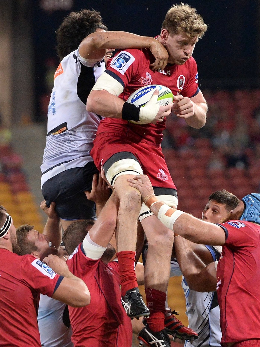 Key recruit ... Adam Thomson during his Reds debut against the Force
